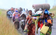 Displaced families flee from renewed fighting between the Congolese Revolutionary Army (CRA) and Congolese army in Sake